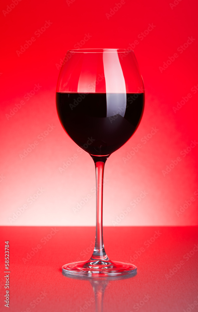 Glass of red wine on red Glass of red wine on red