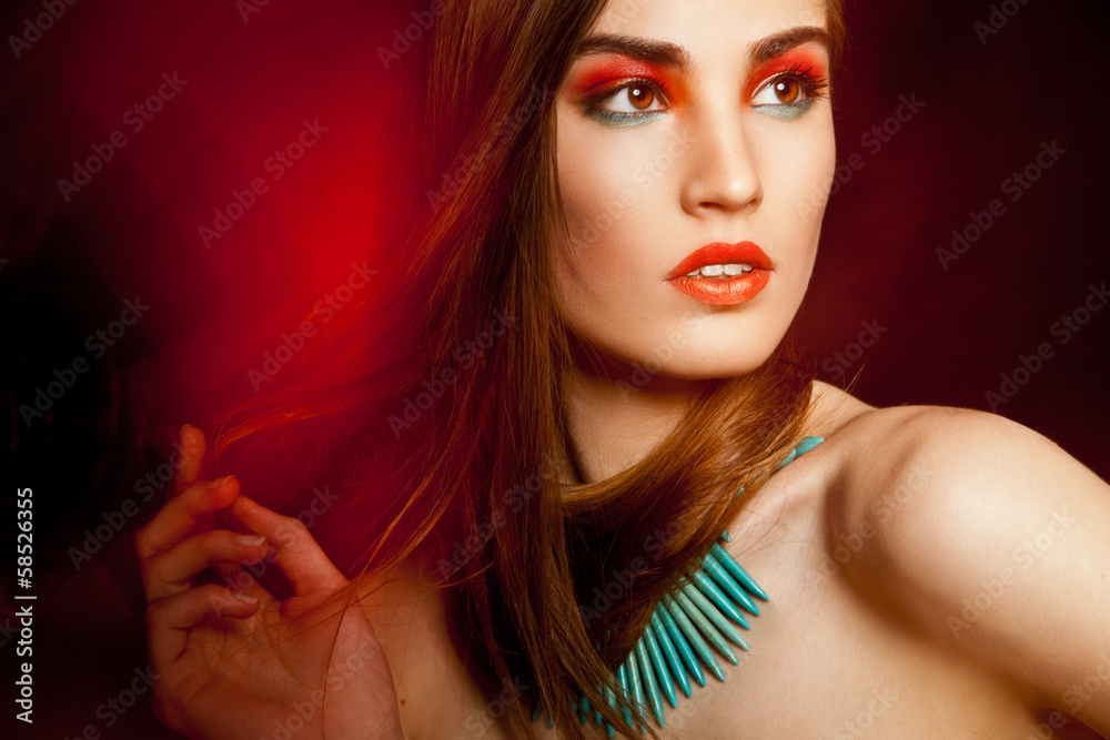 Fototapeta premium Beautyful woman with creative make-up over dark