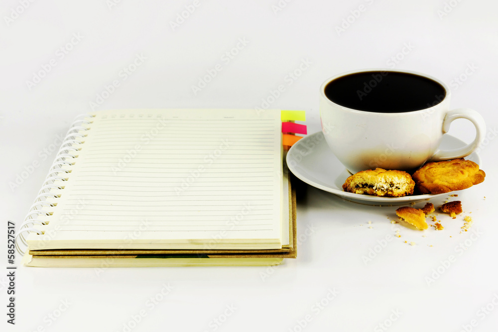 cup of coffee with cookie and notebook isolated on white backgro cup of coffee with cookie and notebook isolated on white backgro