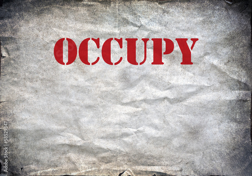 Red Occupy letters on a grunge paper background