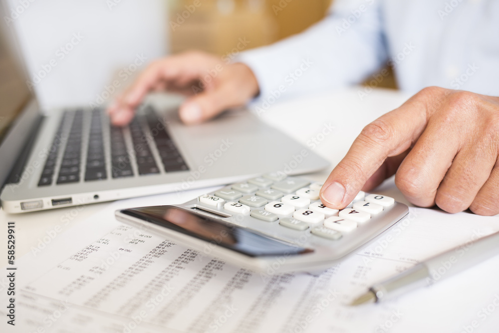 Man doing his accounting, financial adviser working - obrazy, fototapety, plakaty 