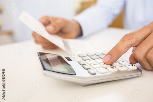 Man doing his accounting, financial adviser working photo