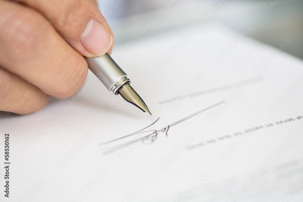 Businessman is Signing a Contract, focus on pen Businessman is Signing a Contract, focus on pen