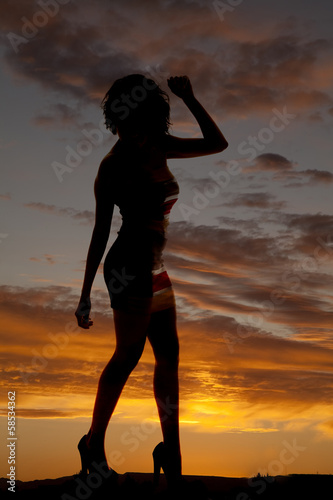 silhouette woman dance arm up