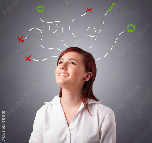 Young woman thinking with abstract marks overhead