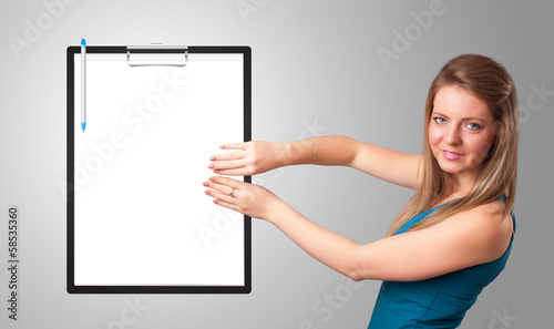 Young girl holding black folder with white sheet copy space