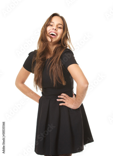 Portrait of an enthusiastic young woman laughing in black dress © mimagephotos