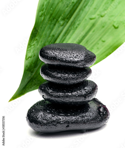 zen stones and leaves with water drops