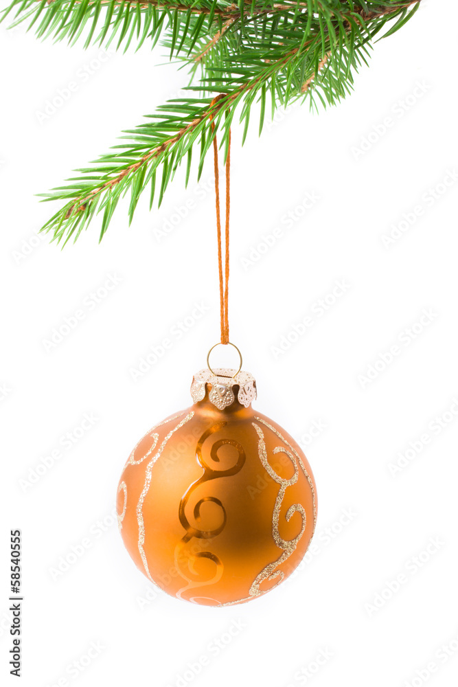 Gold Christmas bauble hanging on a branch