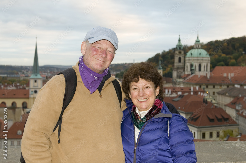 Fototapeta premium middle age senior smiling man woman tourist couple Castle Distri