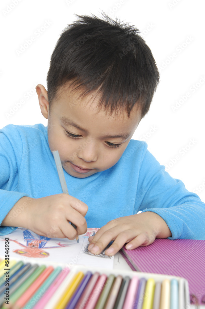 schoolboy sitting and writing in notebook. schoolboy sitting and writing in notebook.