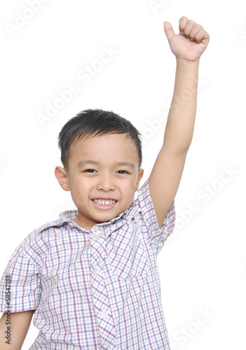 cheerful smiling little boy raised his hands up.