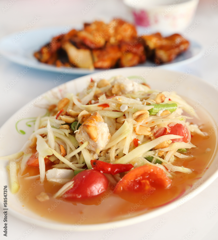 spicy papaya salad and roasting chicken