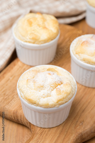 peach souffle in the portioned form on a wooden board, vertical