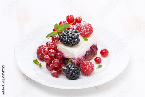 piece of cake with fresh berries on the plate