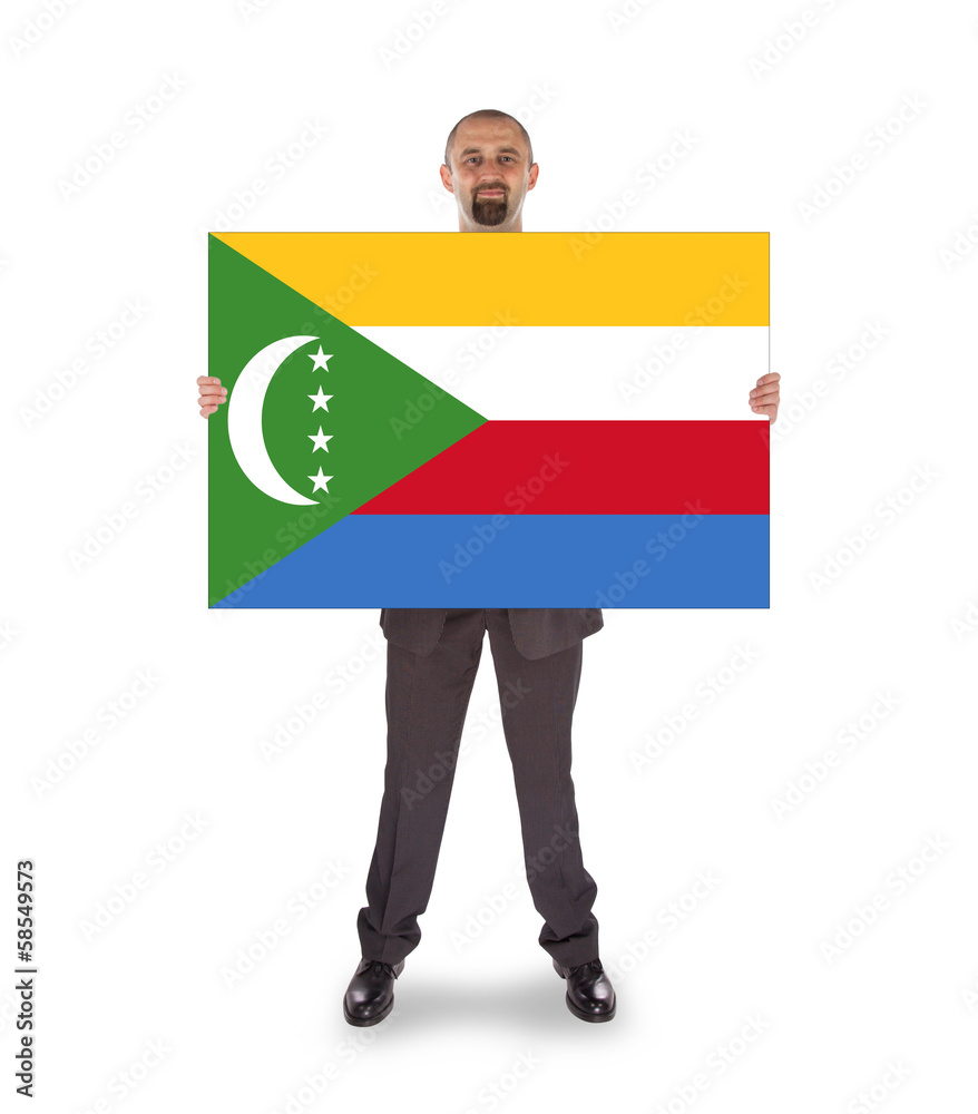 Smiling businessman holding a big card or flag Smiling businessman holding a big card or flag