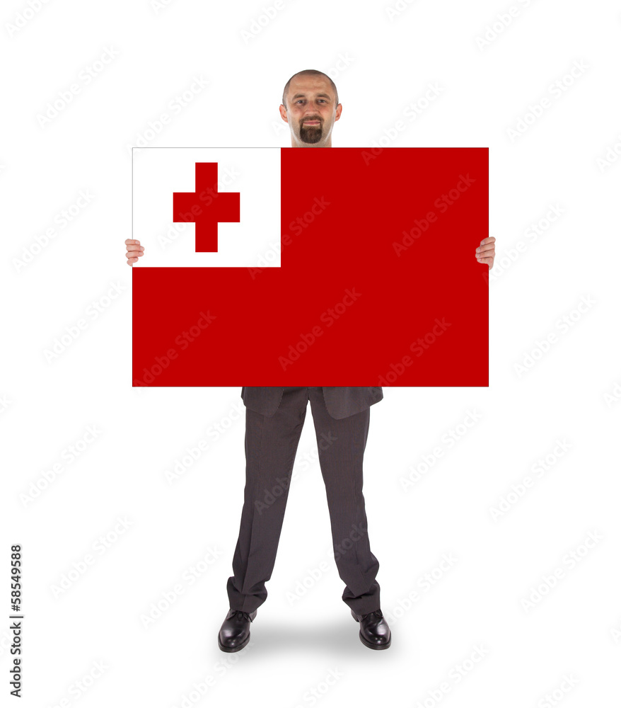 Smiling businessman holding a big card or flag Smiling businessman holding a big card or flag