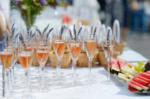 Canvas Print Lots of glasses filled with pink champagne