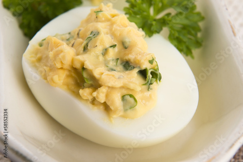 Stuffed eggs with parsley and mayonnaise