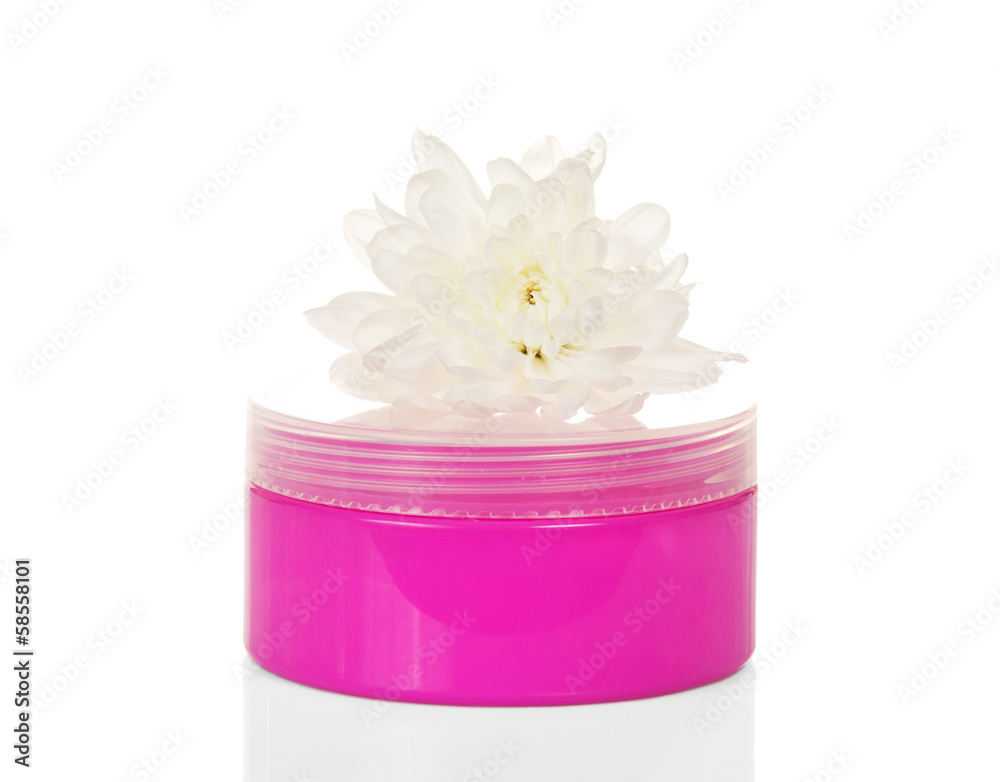 Cosmetic cream in pink container and flower Cosmetic cream in pink container and flower