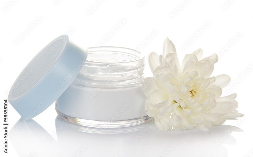 Glass container of cream and fresh flower Glass container of cream and fresh flower