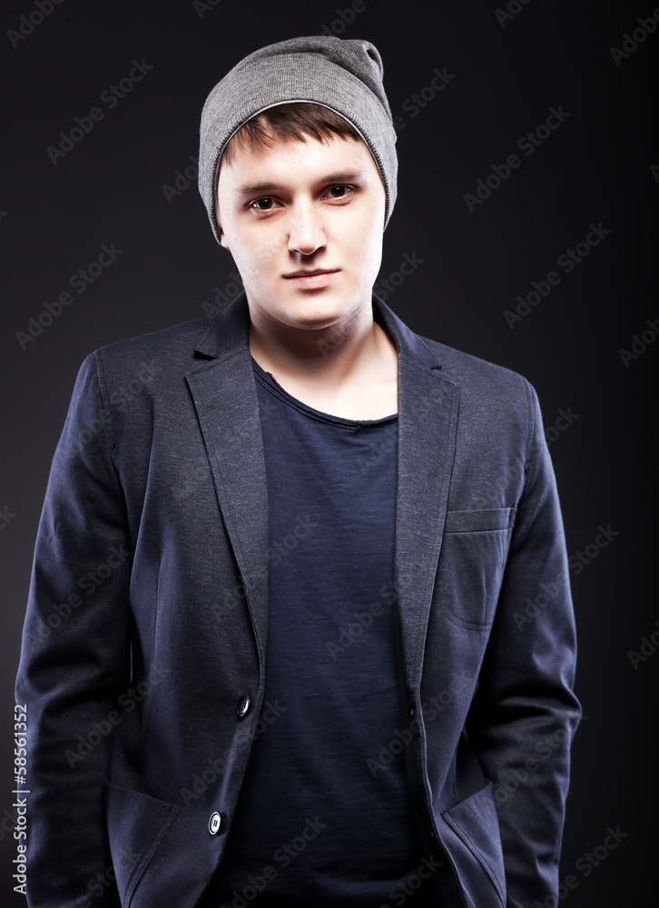 Portrait of casual young man wearing jacket and cap Portrait of casual young man wearing jacket and cap