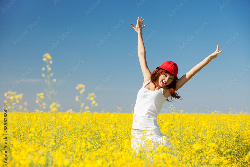 Happy woman in the field with flowers Happy woman in the field with flowers
