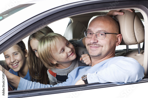 happy father with children in the car
