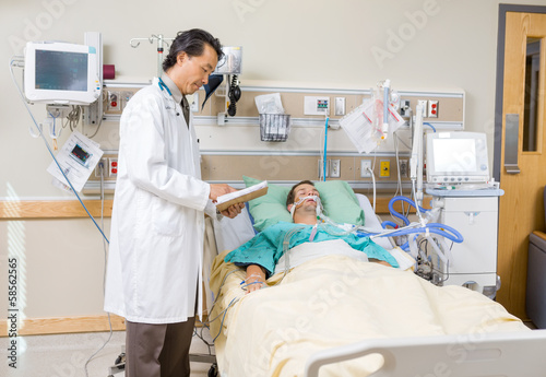 Doctor With Clipboard Examining Patient s Report