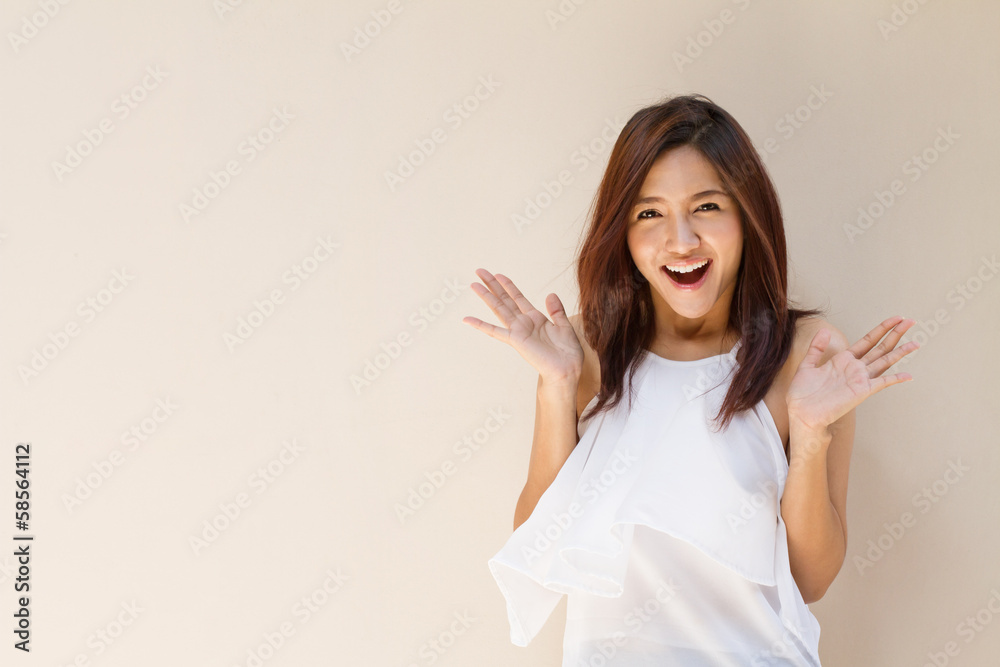 happy woman showing exciting positive expression with blank back happy woman showing exciting positive expression with blank back