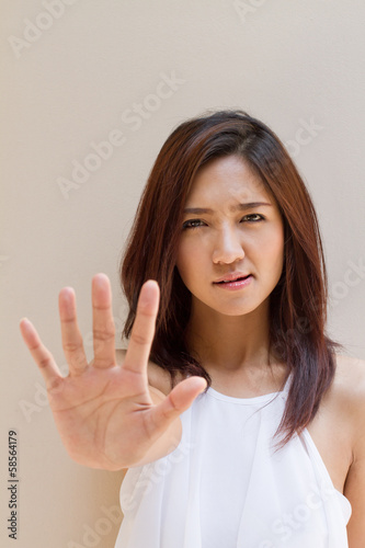 woman with stop, reject, refuse, forbid, negative hand sign