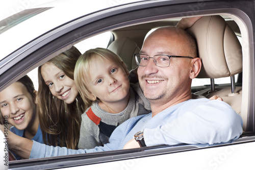 happy father with children in the car