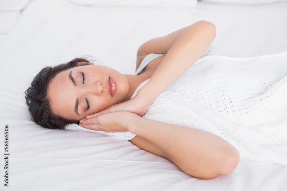 Pretty young woman sleeping with eyes closed in bed Pretty young woman sleeping with eyes closed in bed