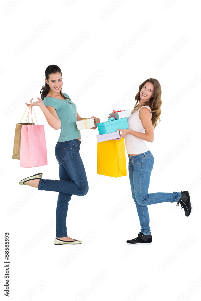 Two happy young female friends with shopping bags Two happy young female friends with shopping bags