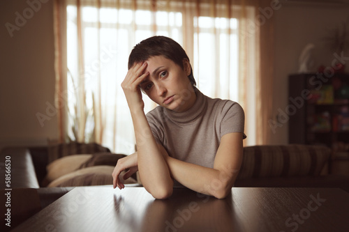 Beautiful sad woman with dark hair