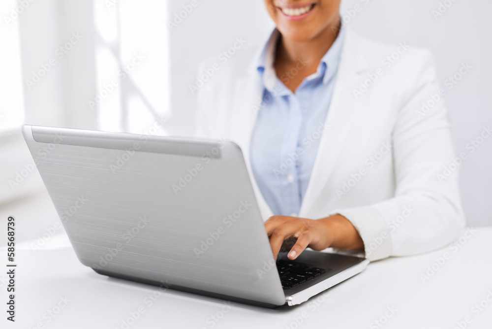 businesswoman using her laptop computer businesswoman using her laptop computer