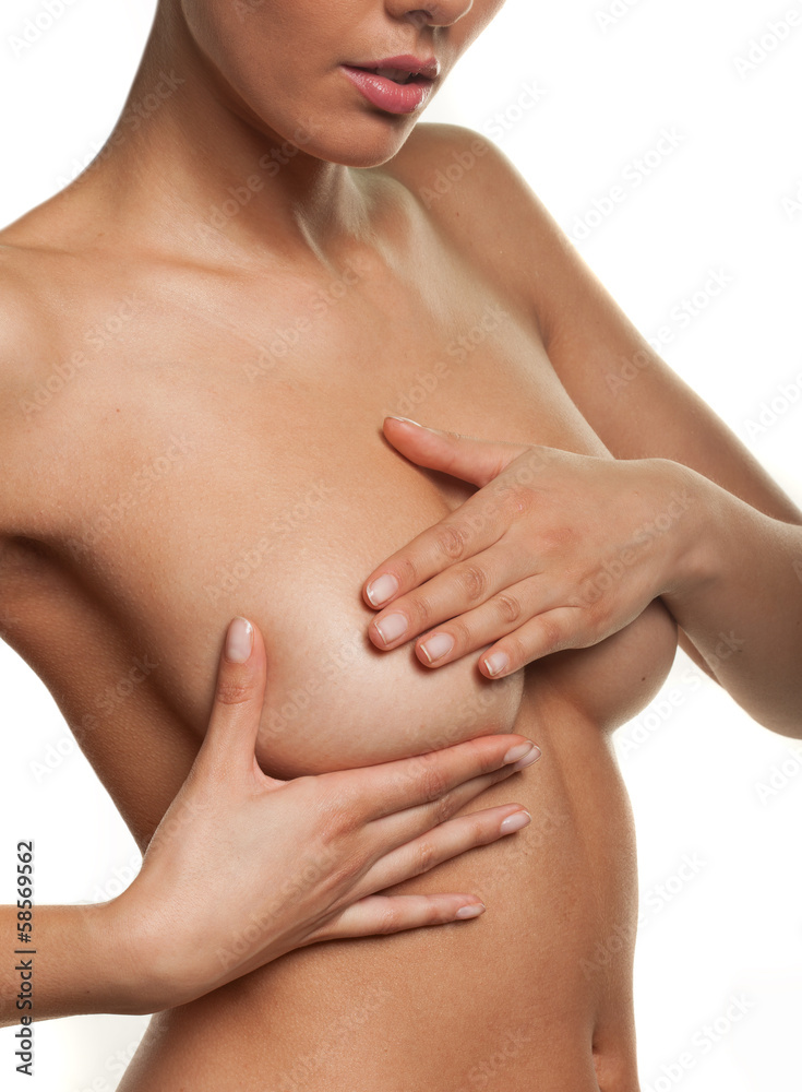 Fototapeta premium Woman manipulating her breast in a cancer check