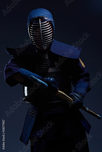 portrait of a kendo fighter with shinai