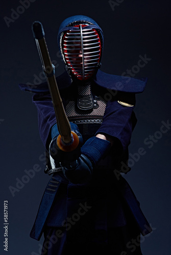 portrait of a kendo fighter with shinai