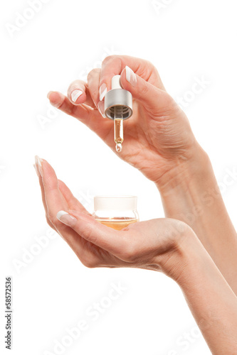 Woman's hands with essential oil