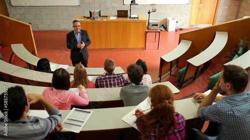 Lecturer speaking to his class in the lecture hall