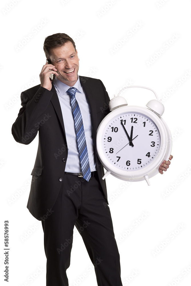 Geschäftsmann mit großer Uhr telefoniert freundlich Geschäftsmann mit großer Uhr telefoniert freundlich