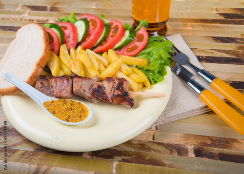 steak and vegetables, french fries photo