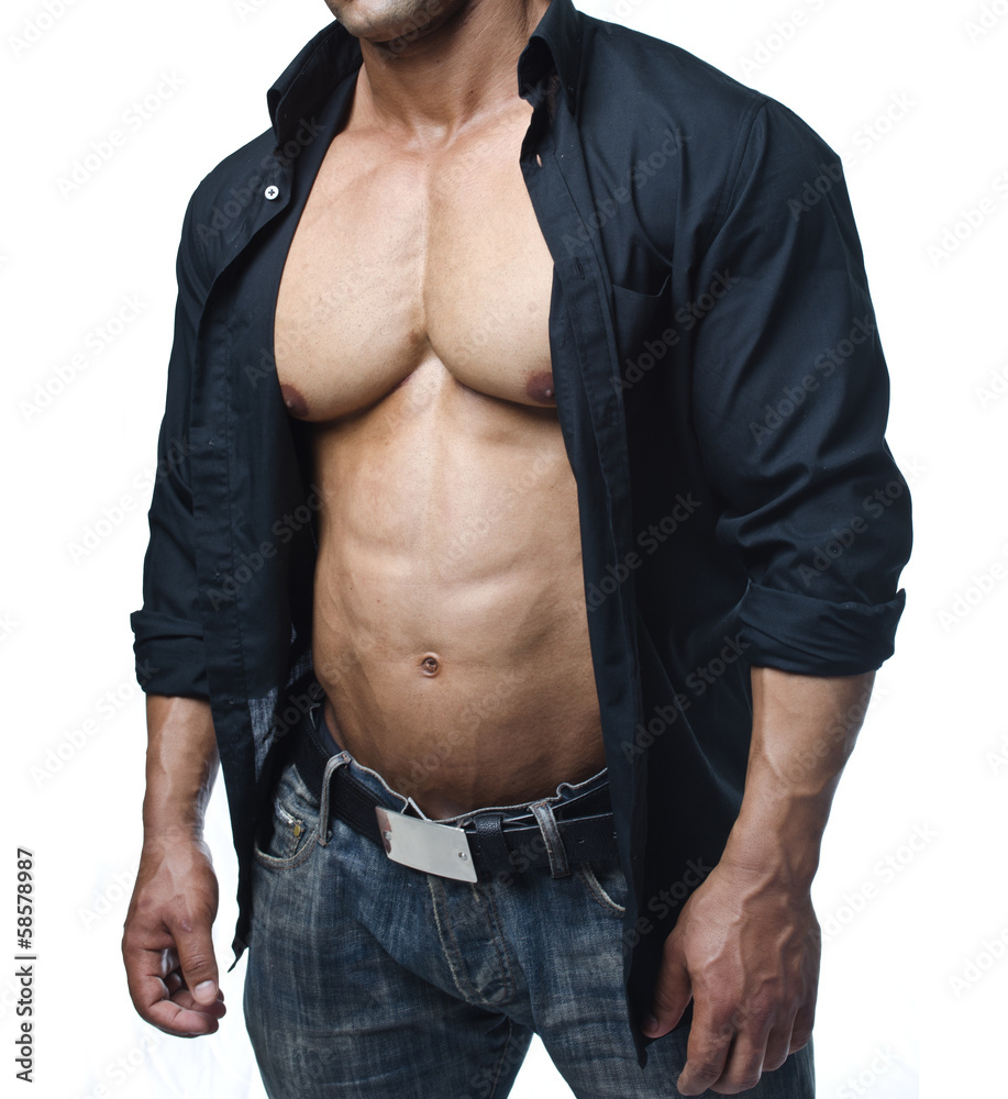 Male bodybuilder in jeans and open shirt revealing pecs and abs Stock-Foto  | Adobe Stock