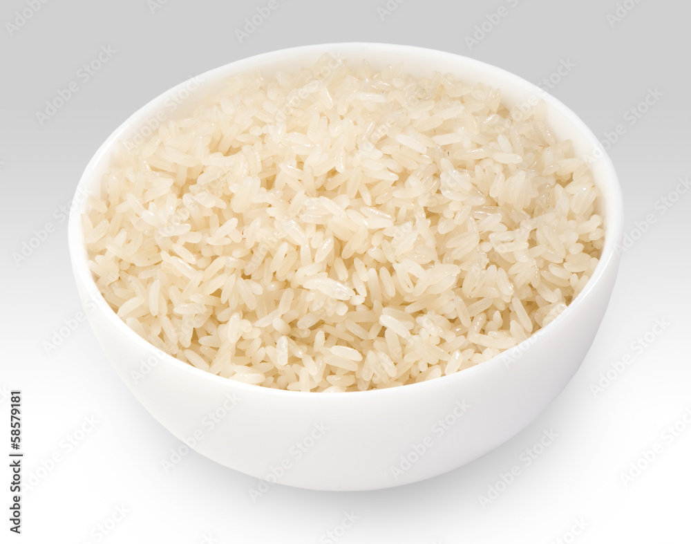 boiled long grain rice in white bowl close-up on white boiled long grain rice in white bowl close-up on white