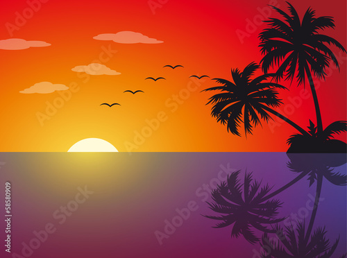 Tropical sunset on the beach with palm trees
