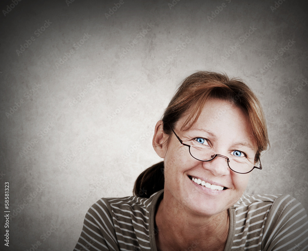 Portrait of a friendly smiling woman with reading glasses Portrait of a friendly smiling woman with reading glasses