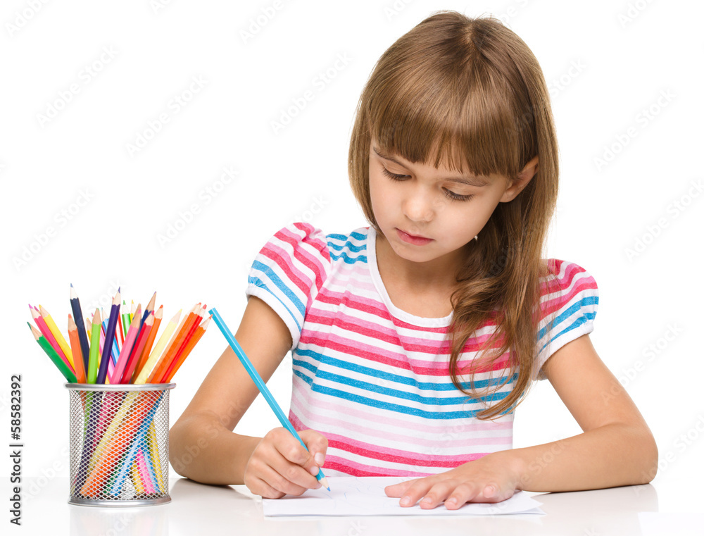 Little girl is drawing using pencils Little girl is drawing using pencils