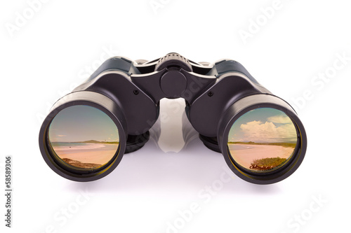 black binoculars and beach isolated on a white background photo