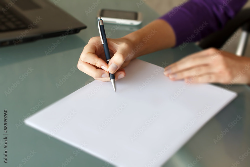 Businesswoman write with pen on blank paper Businesswoman write with pen on blank paper